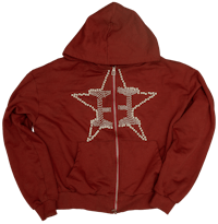 a red hoodie with a star on it